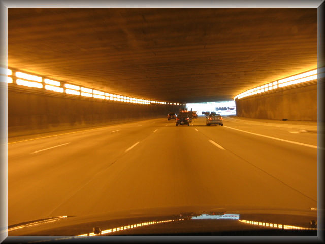Road scene image with yellow tunnel lighting